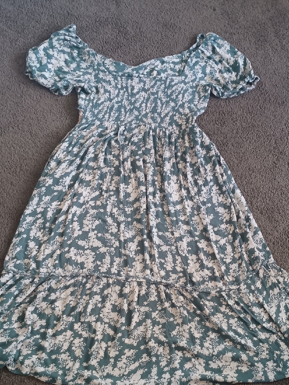 IFree People Ellie Printed Midi Dress in a green floral gauze fabric.